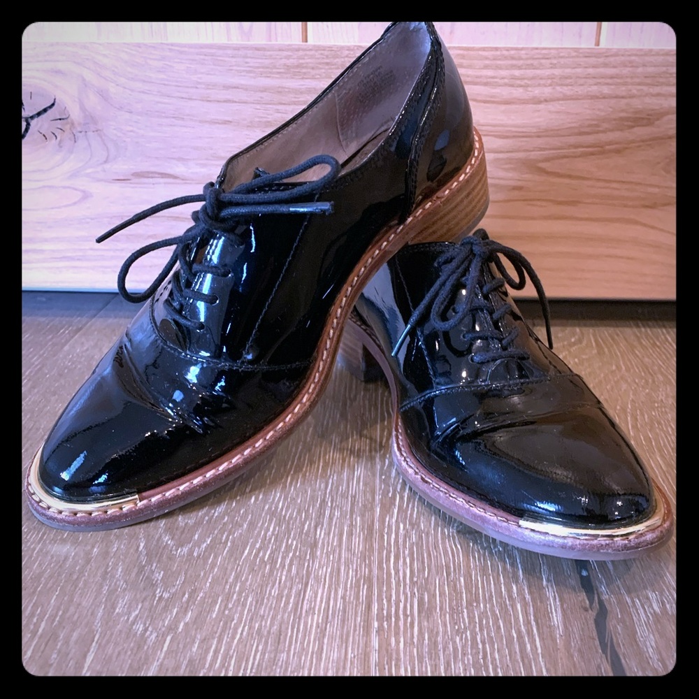 patent leather with gold tips